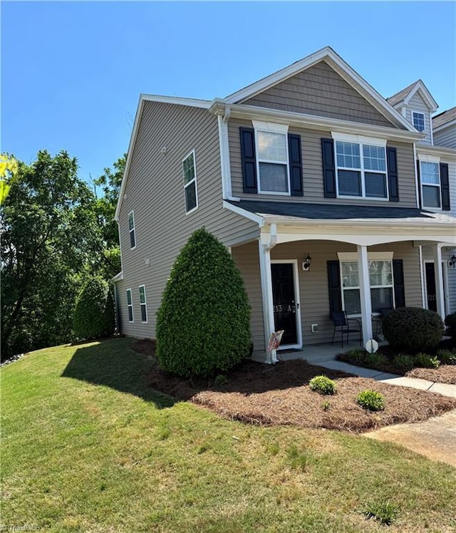 7213 Olmstead Dr, Burlington, NC 27215 - view of front of property featuring a front lawn and covered porch