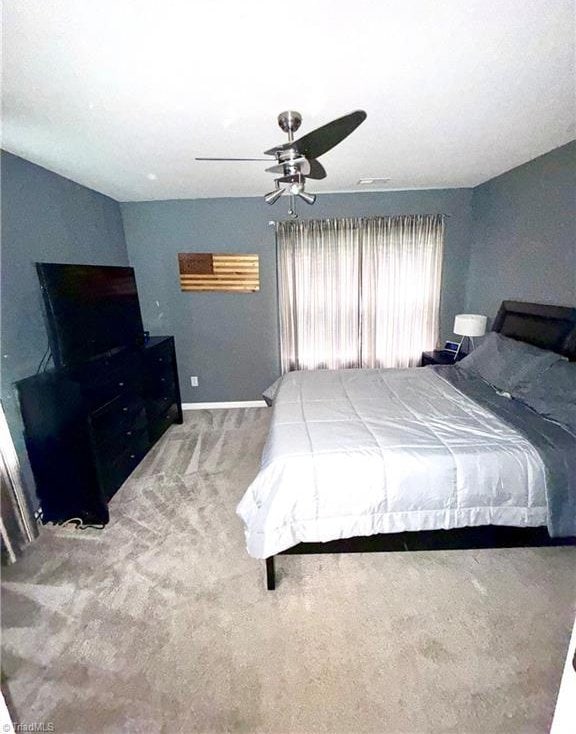 7213 Olmstead Dr, Burlington, NC 27215 - bedroom featuring carpet flooring, baseboards, and ceiling fan