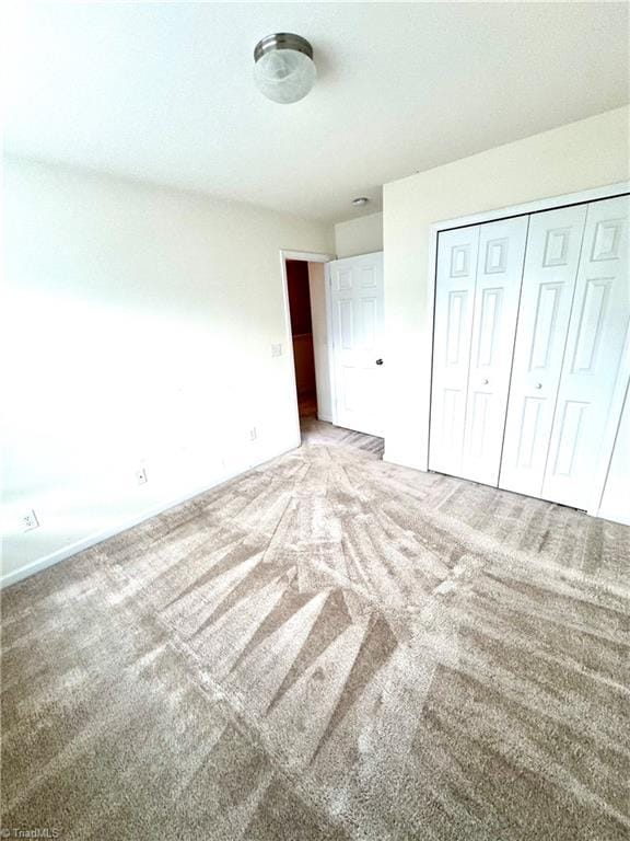 7213 Olmstead Dr, Burlington, NC 27215 - unfurnished bedroom with carpet floors, a closet, and baseboards