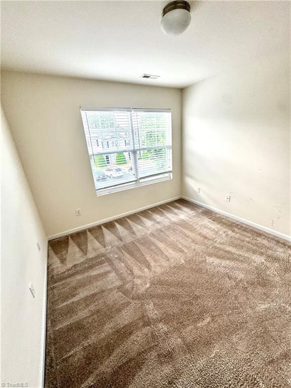 7213 Olmstead Dr, Burlington, NC 27215 - carpeted empty room featuring baseboards