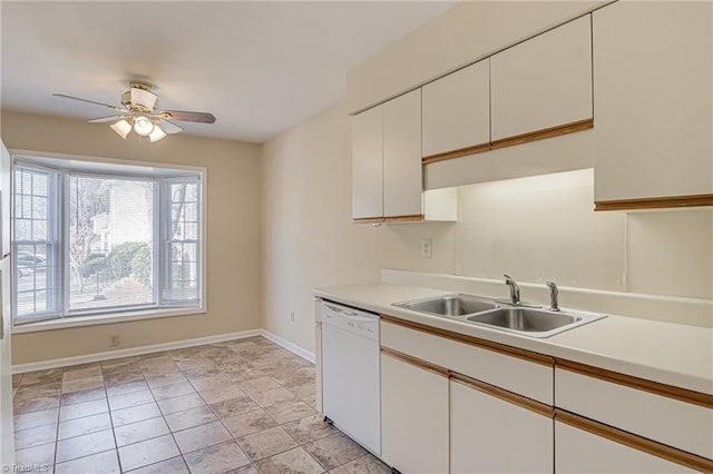 kitchen featuring white cabinetry, sink, ceiling fan, and white dishwasher