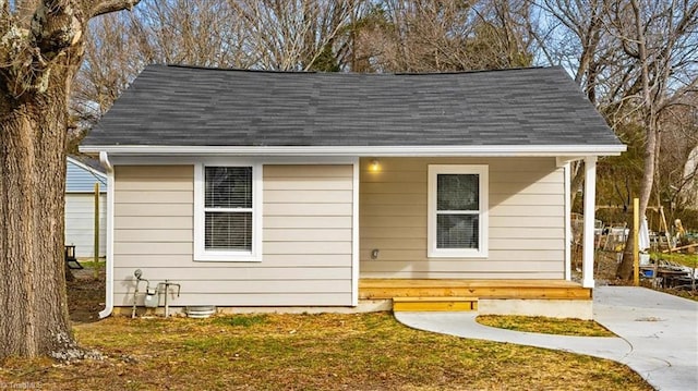 view of outbuilding featuring a yard