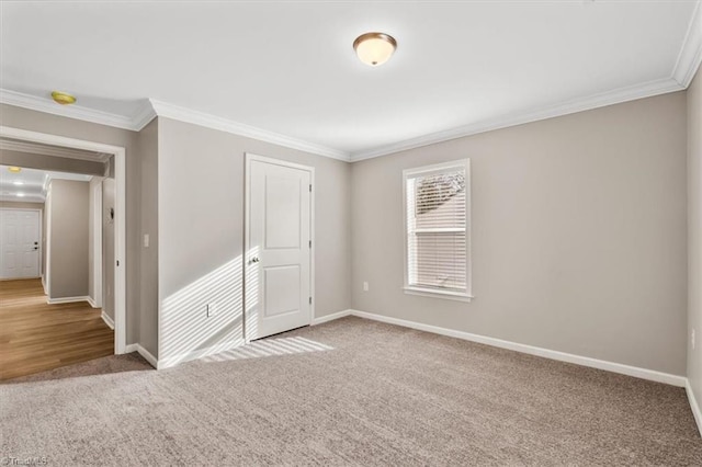 unfurnished bedroom featuring ornamental molding, light colored carpet, and a closet