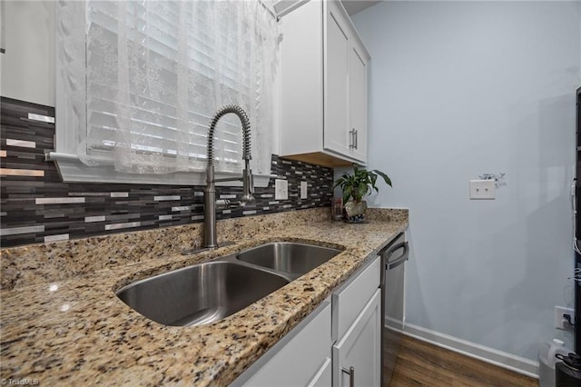 817 Sagemount St, Jamestown, NC 27282 - kitchen with a sink, dark wood-style flooring, backsplash, white cabinetry, and baseboards
