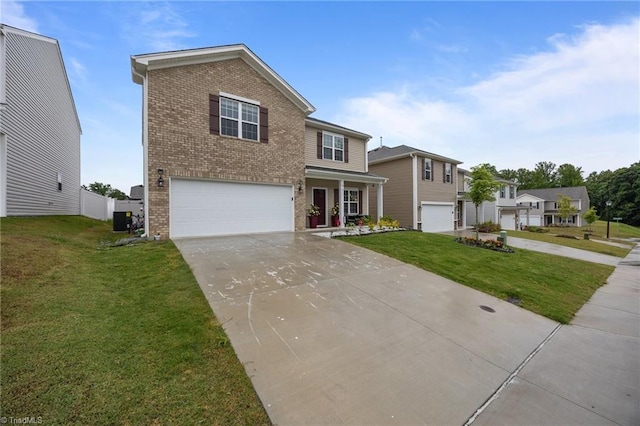 817 Sagemount St, Jamestown, NC 27282 - traditional-style house with brick siding, a garage, concrete driveway, a front yard, and central AC unit