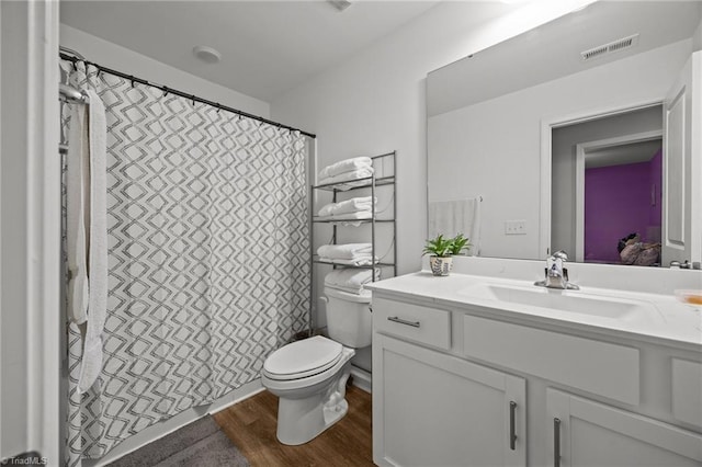 817 Sagemount St, Jamestown, NC 27282 - bathroom with toilet, vanity, wood finished floors, and curtained shower