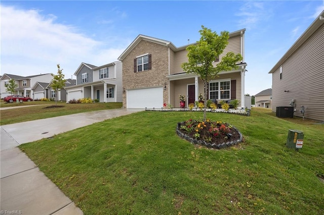 817 Sagemount St, Jamestown, NC 27282 - traditional-style house with central AC, concrete driveway, a garage, and a front lawn