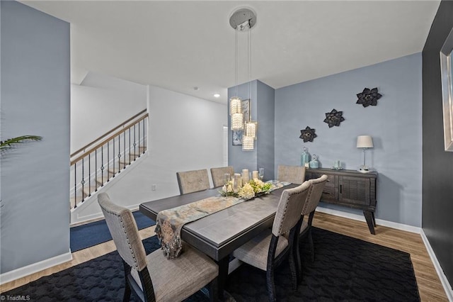 817 Sagemount St, Jamestown, NC 27282 - dining room featuring wood finished floors, a chandelier, baseboards, stairs, and recessed lighting