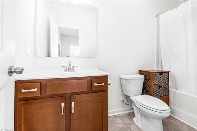 bathroom with toilet, vanity, baseboards, and shower / tub combo with curtain