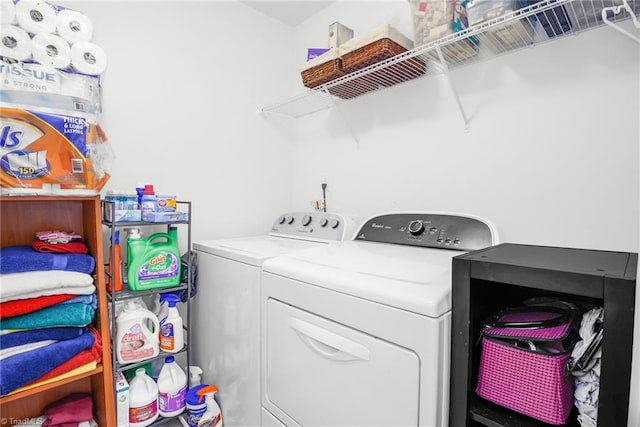 laundry area with washing machine and clothes dryer