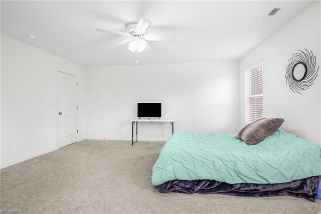 bedroom featuring carpet, a ceiling fan, and baseboards