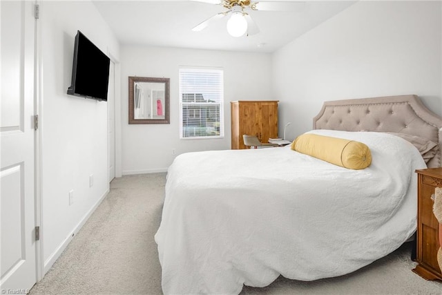 bedroom with carpet, baseboards, and a ceiling fan