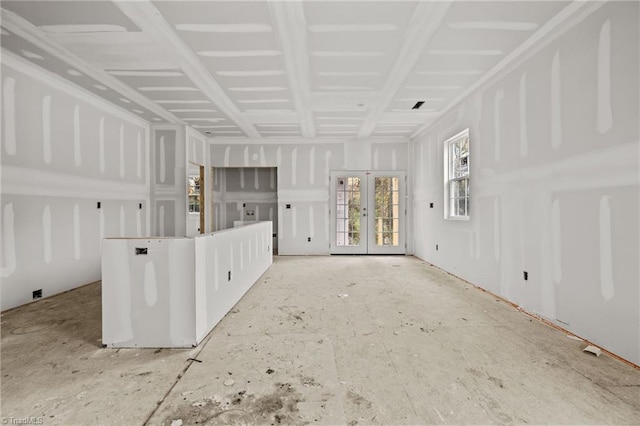 unfurnished living room with french doors