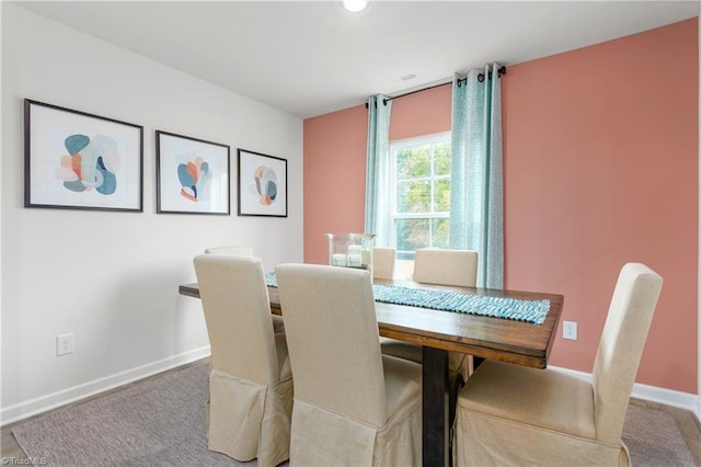 view of carpeted dining area