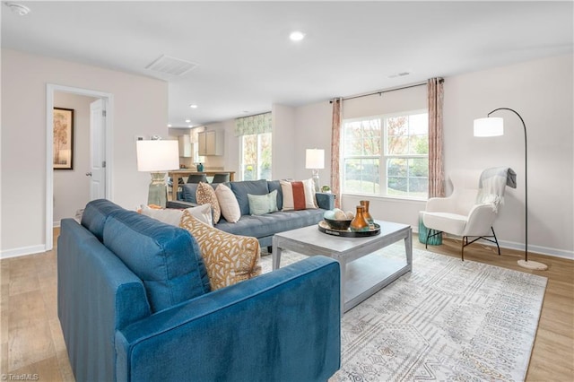 living room with light hardwood / wood-style flooring