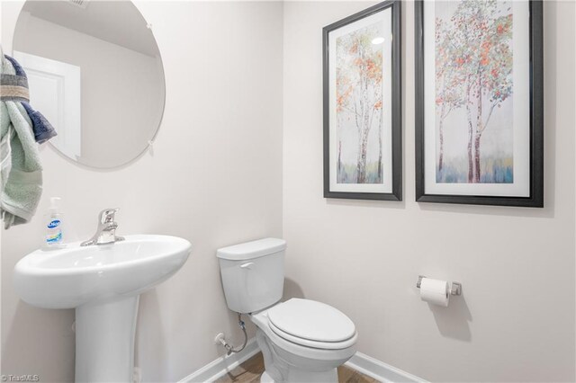 bathroom with sink and toilet