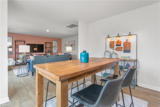 dining room featuring light hardwood / wood-style floors