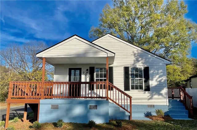 back of house with covered porch