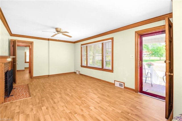 4750 Carlton Dr, Winston-Salem, NC 27105 - unfurnished living room with ornamental molding, light wood-style floors, a ceiling fan, baseboards, and a fireplace