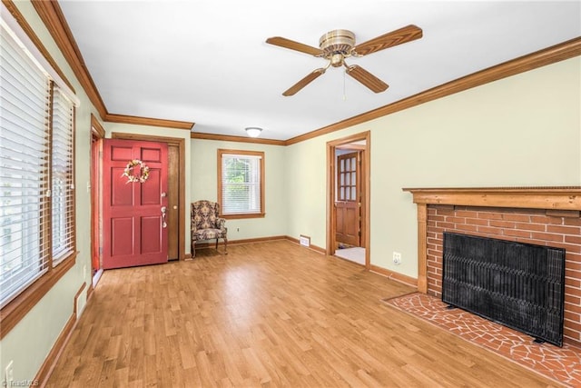 4750 Carlton Dr, Winston-Salem, NC 27105 - unfurnished living room featuring light wood-style floors, a ceiling fan, baseboards, ornamental molding, and a brick fireplace