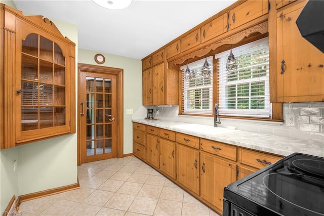 4750 Carlton Dr, Winston-Salem, NC 27105 - kitchen with electric range, a sink, tasteful backsplash, and light countertops