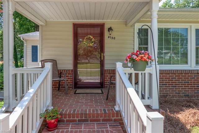 4750 Carlton Dr, Winston-Salem, NC 27105 - property entrance with brick siding and a porch
