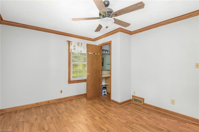 4750 Carlton Dr, Winston-Salem, NC 27105 - unfurnished room with wood finished floors, ornamental molding, baseboards, and a ceiling fan