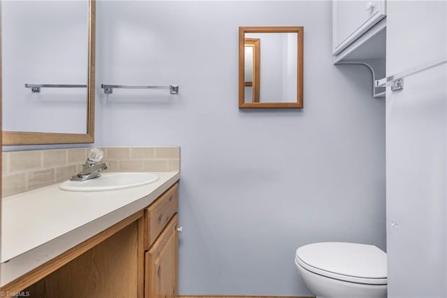 4750 Carlton Dr, Winston-Salem, NC 27105 - bathroom with vanity, toilet, and backsplash