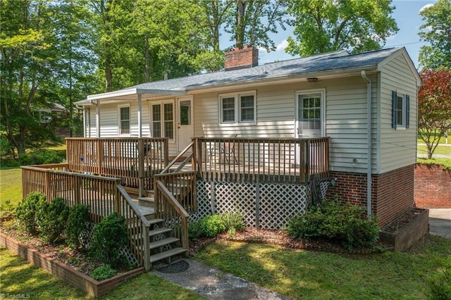 4750 Carlton Dr, Winston-Salem, NC 27105 - back of property with a wooden deck, a chimney, and stairway