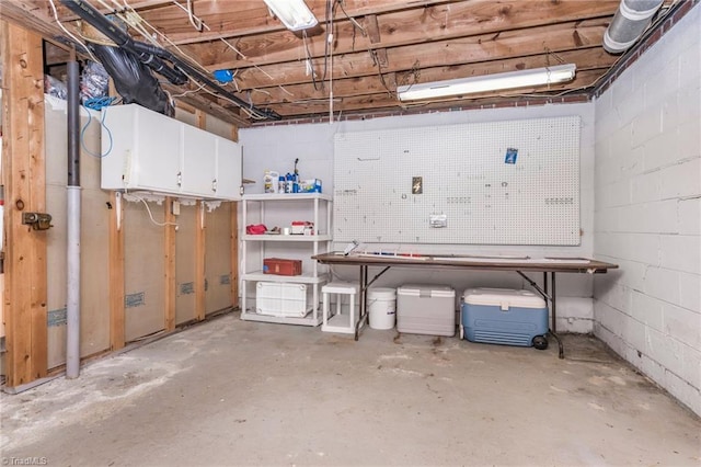 4750 Carlton Dr, Winston-Salem, NC 27105 - basement with concrete block wall and a workshop area