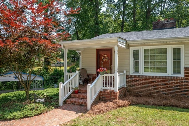 4750 Carlton Dr, Winston-Salem, NC 27105 - bungalow-style home with brick siding, a porch, roof with shingles, and a chimney