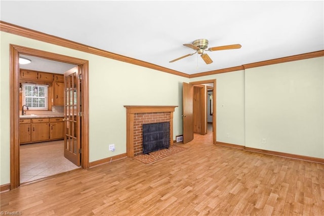 4750 Carlton Dr, Winston-Salem, NC 27105 - unfurnished living room with a sink, ceiling fan, light wood-type flooring, ornamental molding, and baseboards