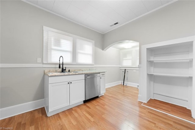 kitchen with crown molding, white cabinetry, sink, light hardwood / wood-style floors, and dishwasher