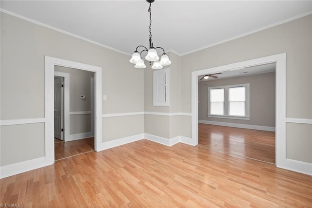 empty room with ornamental molding, light hardwood / wood-style floors, and ceiling fan with notable chandelier