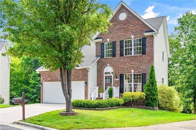 traditional home with an attached garage, driveway, a front lawn, and brick siding