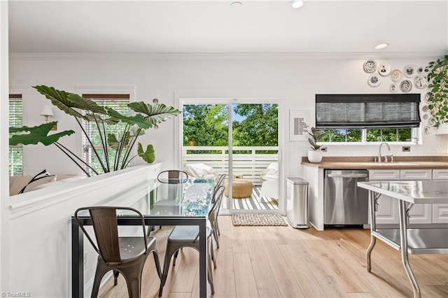 sunroom / solarium featuring a sink