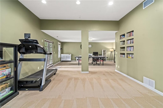 exercise room featuring carpet floors and visible vents