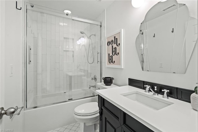 bathroom featuring visible vents, vanity, tile patterned floors, toilet, and enclosed tub / shower combo
