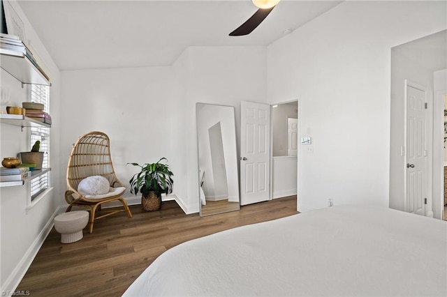 bedroom featuring baseboards, a ceiling fan, vaulted ceiling, and wood finished floors