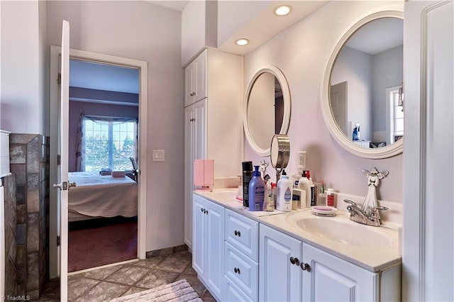 bathroom with tile patterned floors and vanity