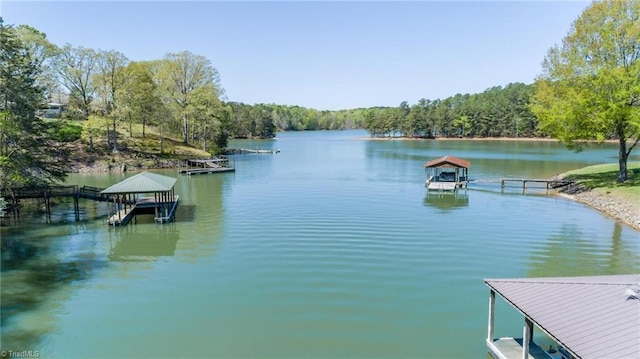 179 Abington Ln, Troutman, NC 28166 - dock area featuring a water view, a forest view, and boat lift