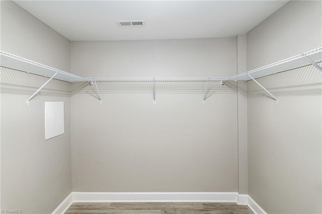 5515 Bethania Rd, Pfafftown, NC 27040 - walk in closet with wood finished floors