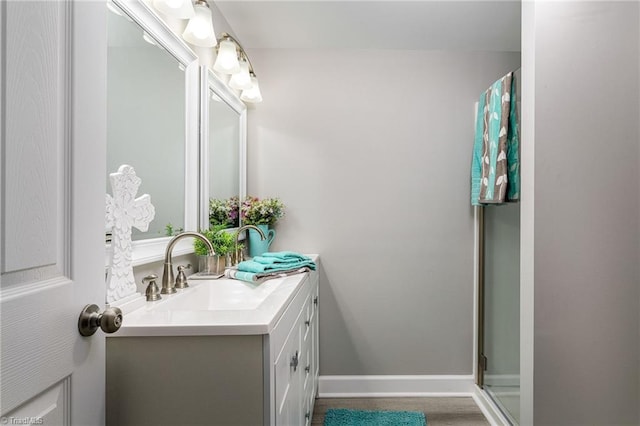 5515 Bethania Rd, Pfafftown, NC 27040 - bathroom featuring vanity, a shower with door, and baseboards