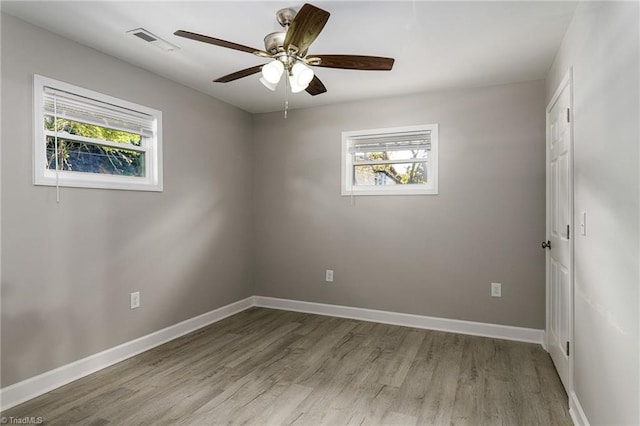 spare room featuring light hardwood / wood-style flooring and ceiling fan