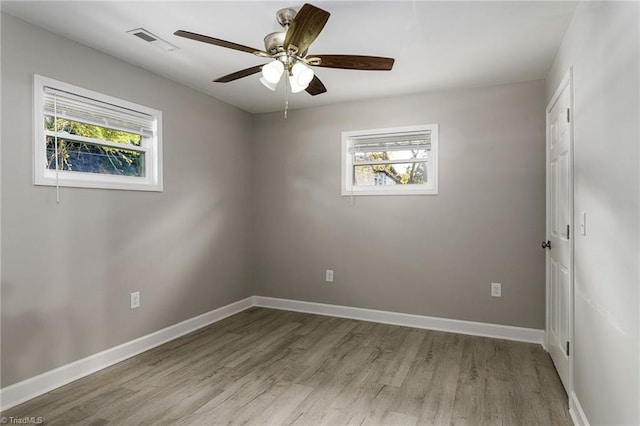 5515 Bethania Rd, Pfafftown, NC 27040 - unfurnished room with plenty of natural light, wood finished floors, ceiling fan, and baseboards