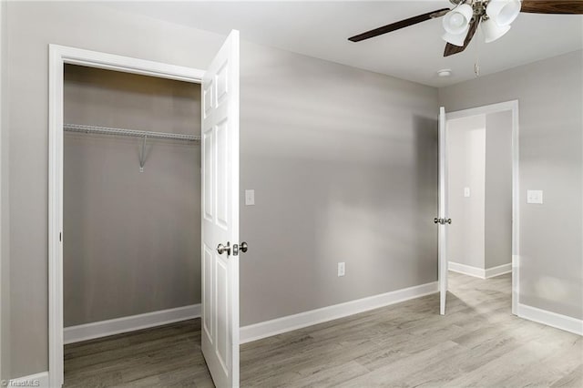 unfurnished bedroom featuring a closet, ceiling fan, and light hardwood / wood-style floors