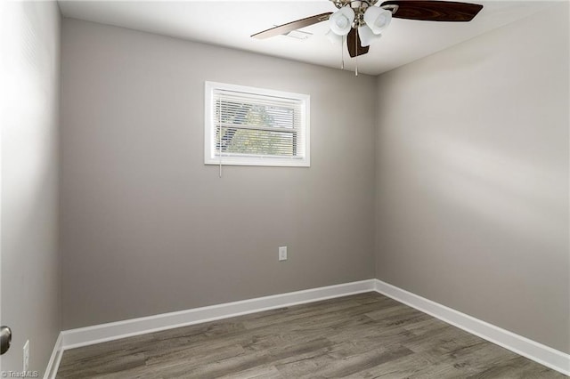 unfurnished room with ceiling fan and wood-type flooring