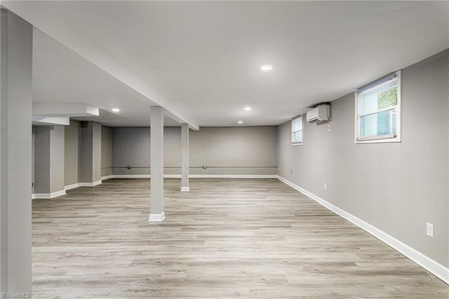 5515 Bethania Rd, Pfafftown, NC 27040 - below grade area featuring an AC wall unit, light wood-style floors, baseboards, and recessed lighting
