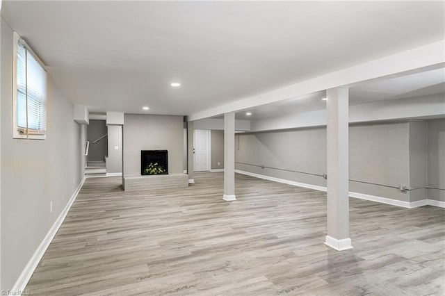 5515 Bethania Rd, Pfafftown, NC 27040 - below grade area with a fireplace, baseboards, light wood-style flooring, recessed lighting, and stairway