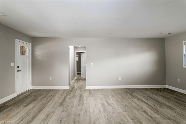 spare room with light hardwood / wood-style floors